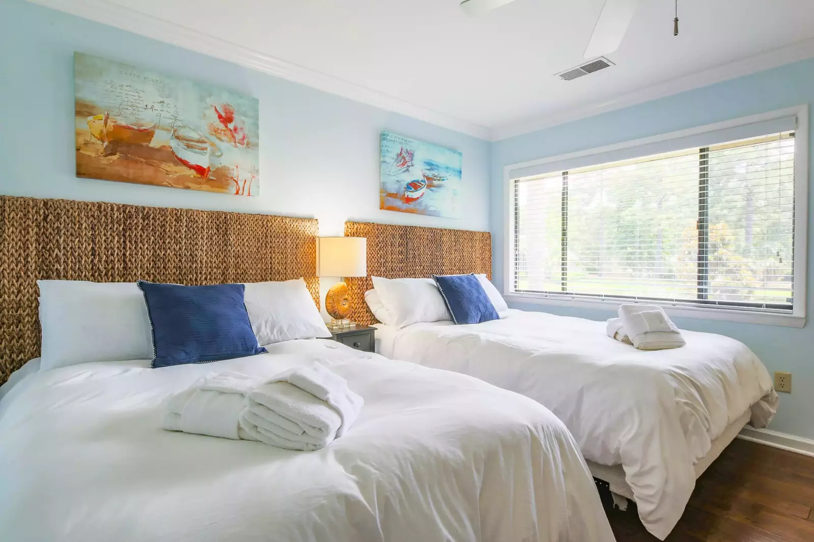 The guest bedroom, which is located on the lower level, features a queen bed and a full bed.