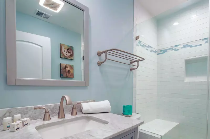 There is a bench within the walk-in shower.