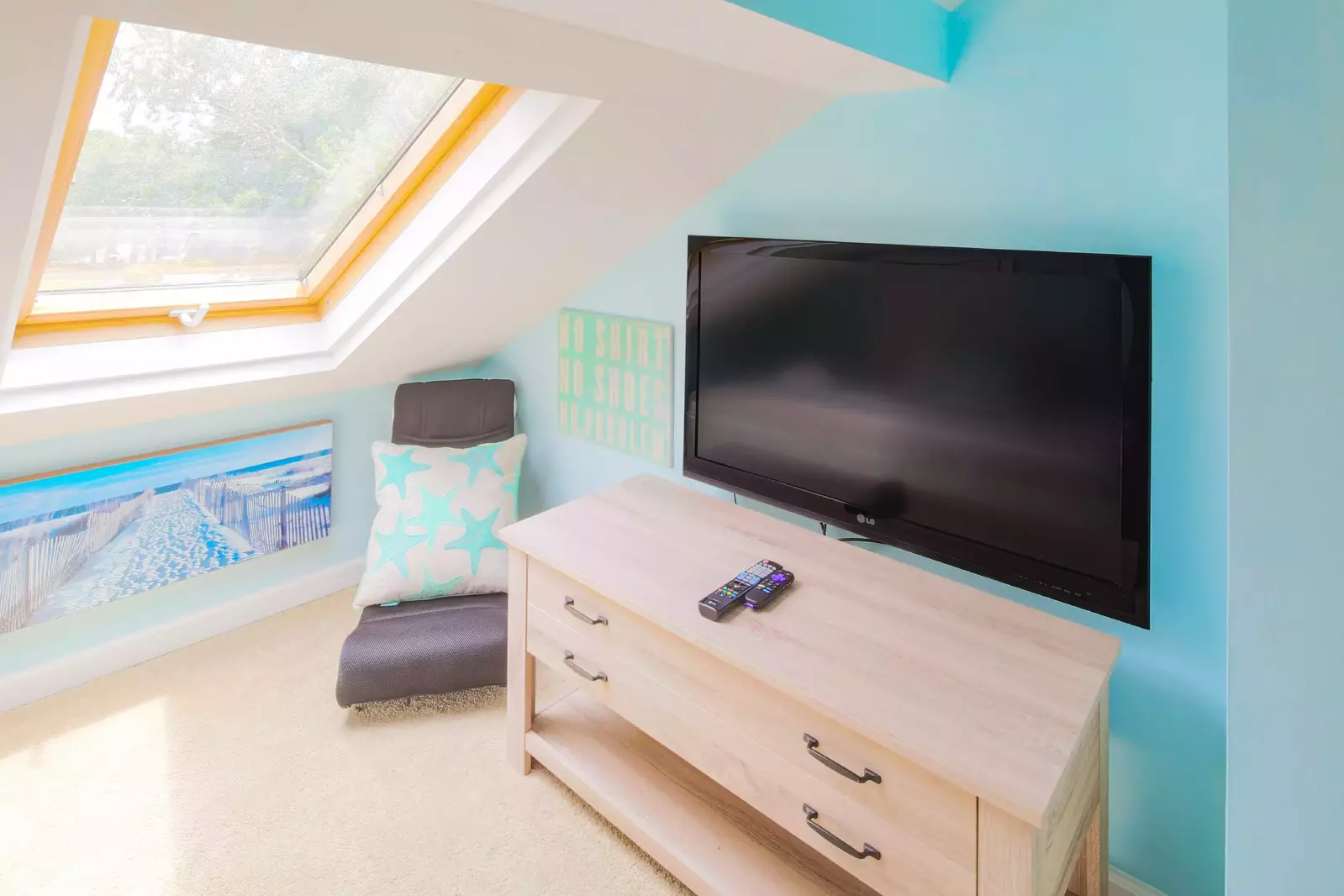 There is also a wall-mounted TV in the loft.