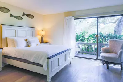 This lower level suite has sliding door access to a private balcony.