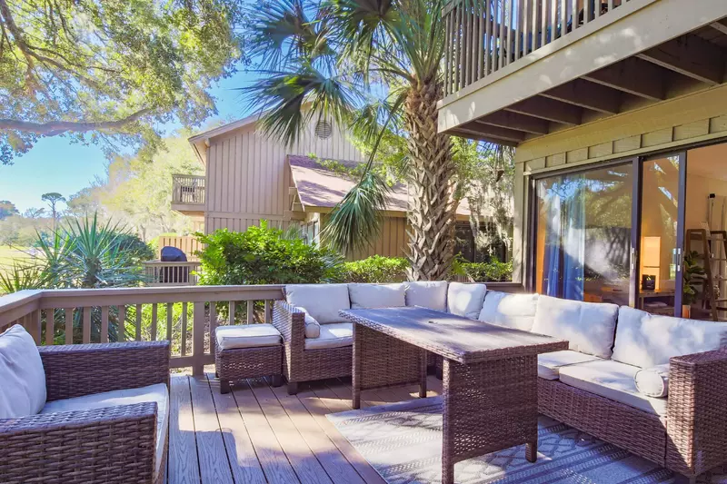 The live oak and palmetto trees alongside the villa provide nice shading on the back deck.