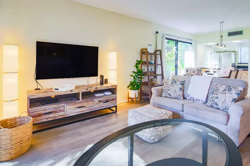 There is an open floor plan layout between the living room, dining area and kitchen.