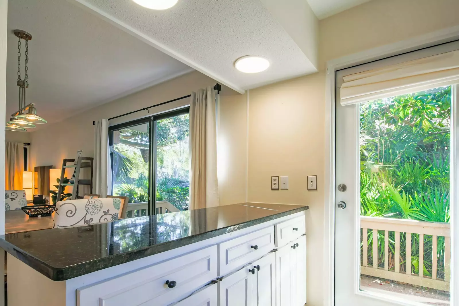 The open layout makes it easy to interact with your guests in the kitchen, living room and dining area.