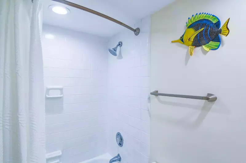 The lower level en suite bathroom also has a shower/tub combo.