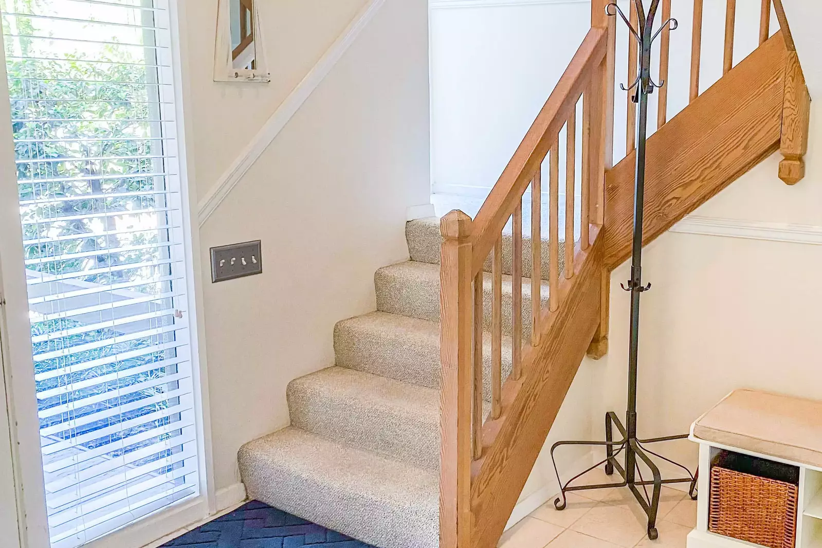 This stairway near the front door leads to the villa's other bedrooms.