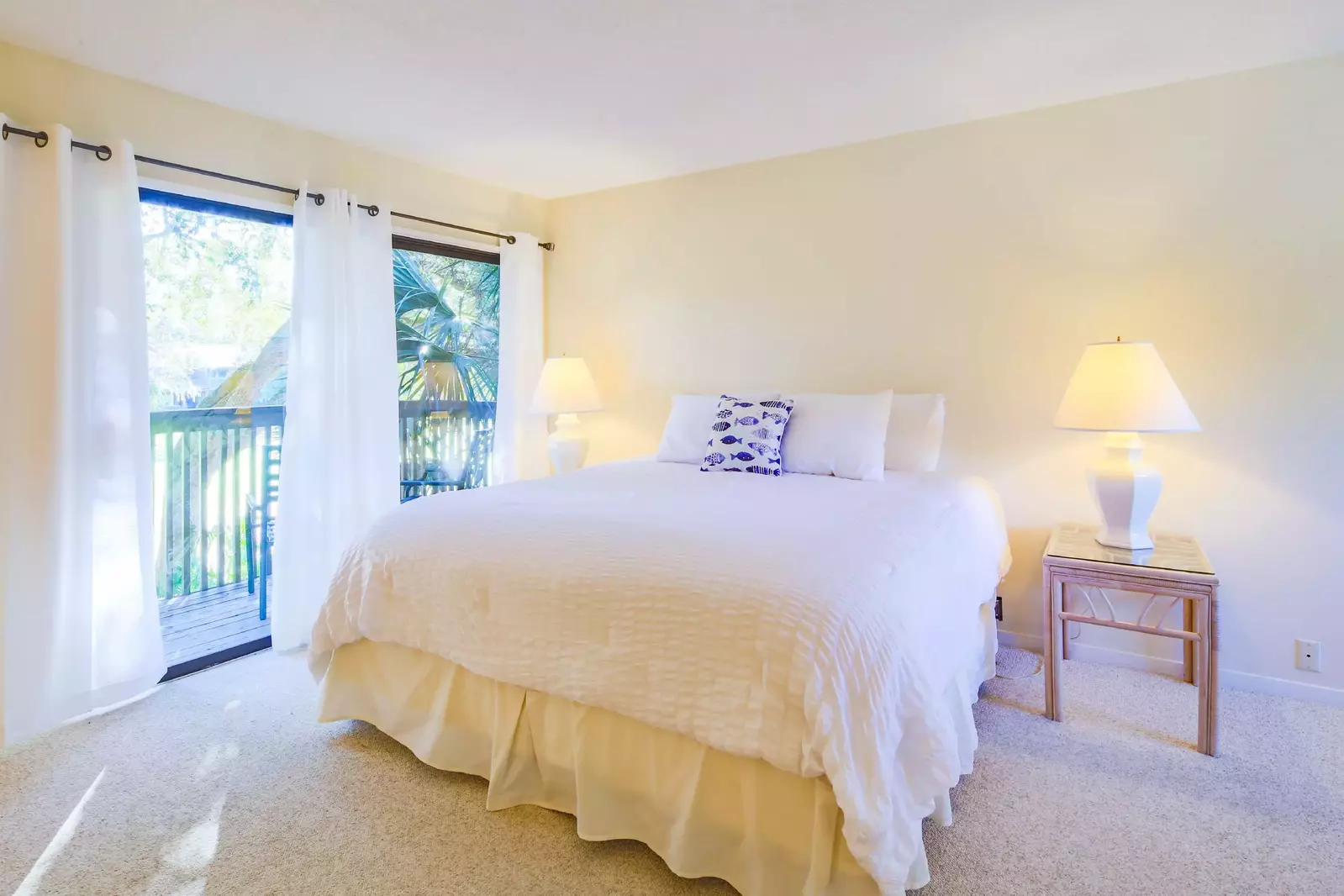 The king suite features a king bed and night stands with reading lamps.