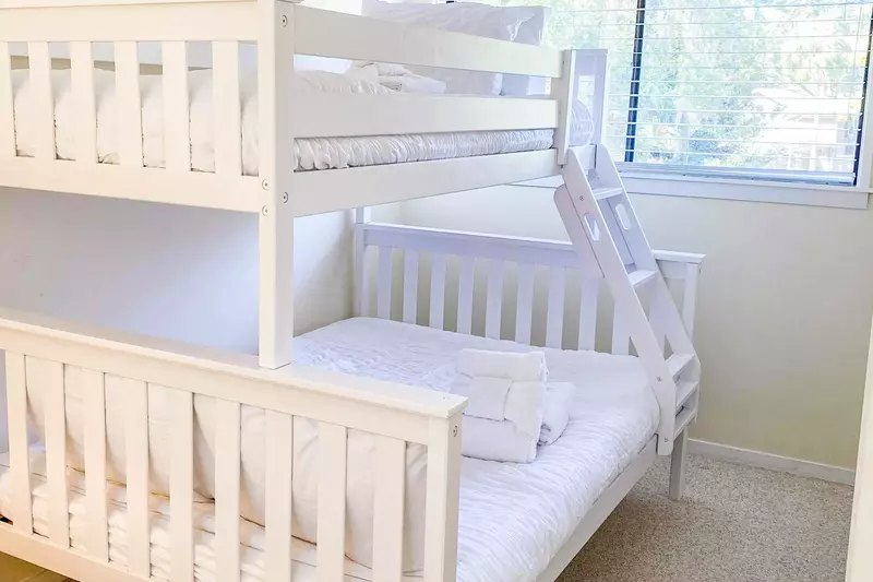 The bunk bed features a full bed on the bottom bunk and a twin bed on the top bunk.
