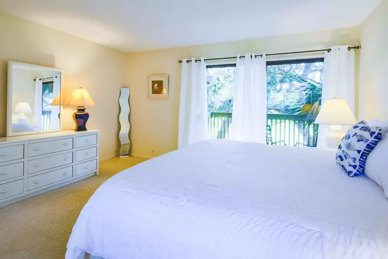 The king suite also has a large dresser, two mirrors and access to a private balcony.