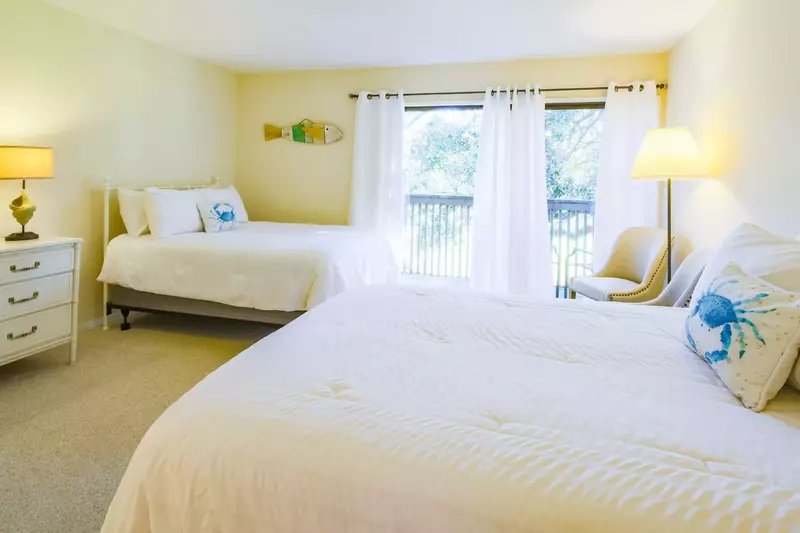 This suite, located on the upper level, features two full beds.