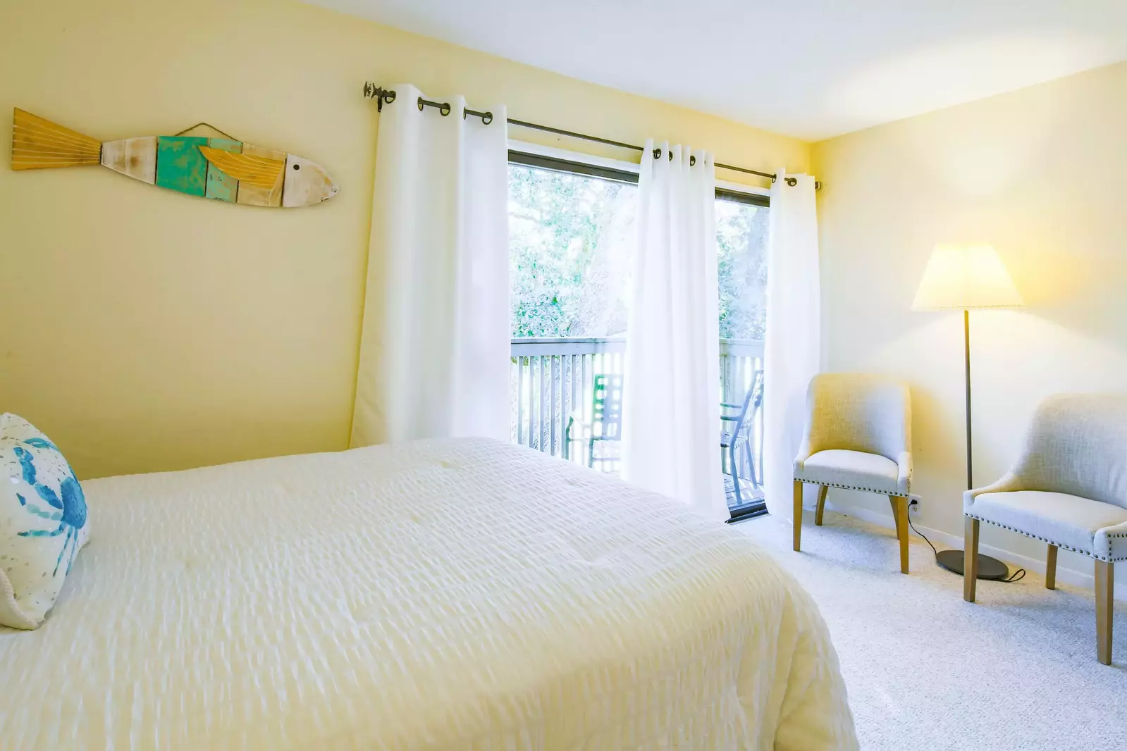 There is also a seating area near the sliding glass door to the private balcony.