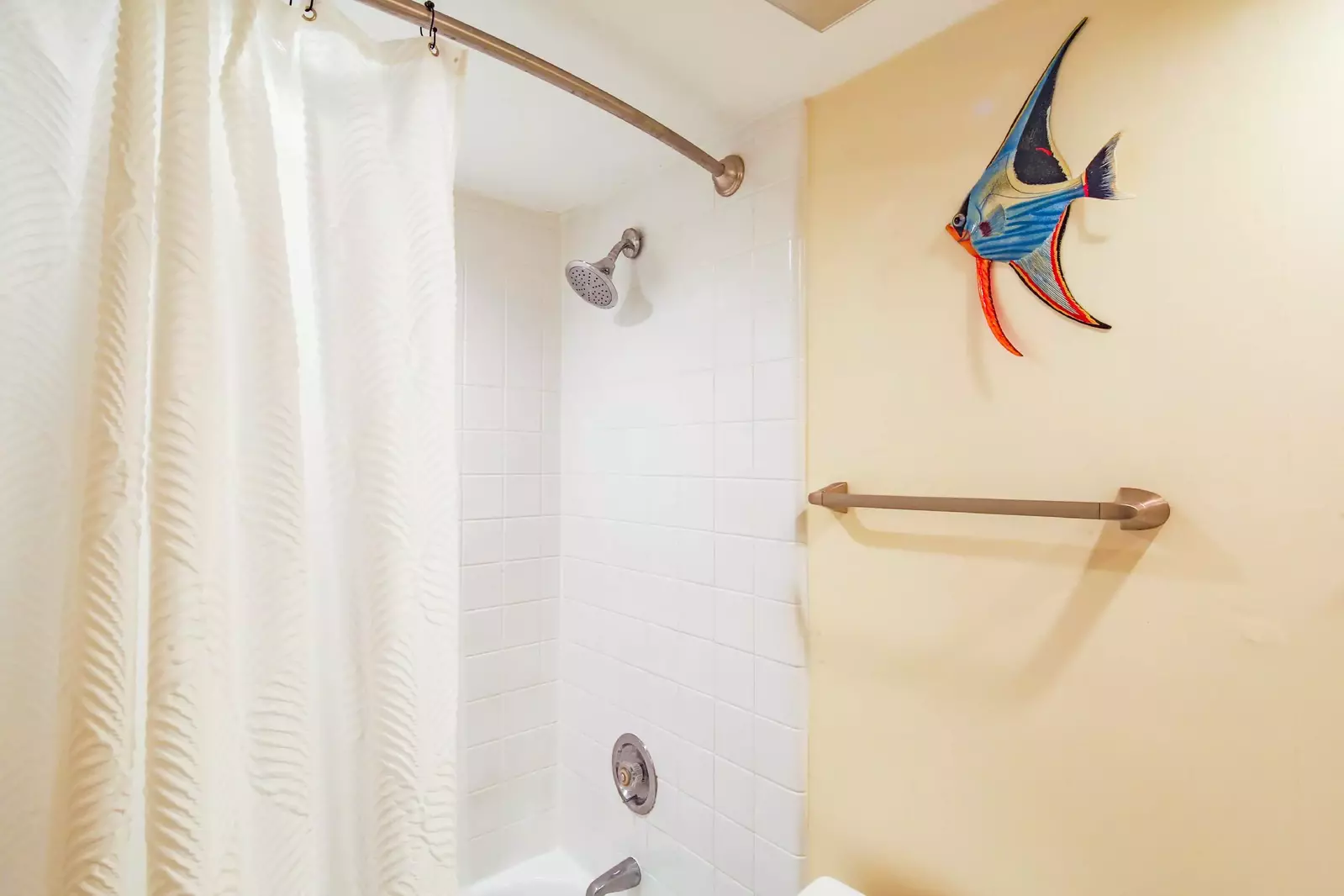 The en suite bathroom also has a shower/tub combo.