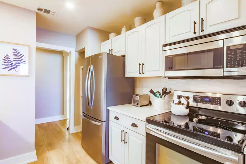 When you enter the front door, you'll find a hallway that leads to the kitchen and living room.