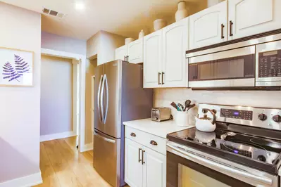 When you enter the front door, you'll find a hallway that leads to the kitchen and living room.