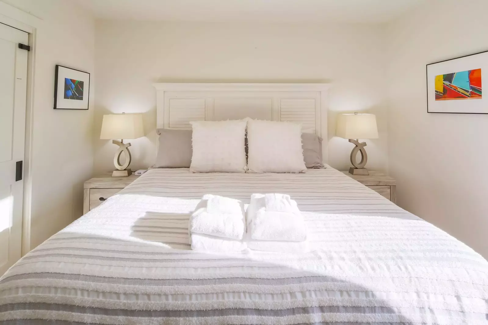 The guest bedroom features a king bed and lovely natural light.