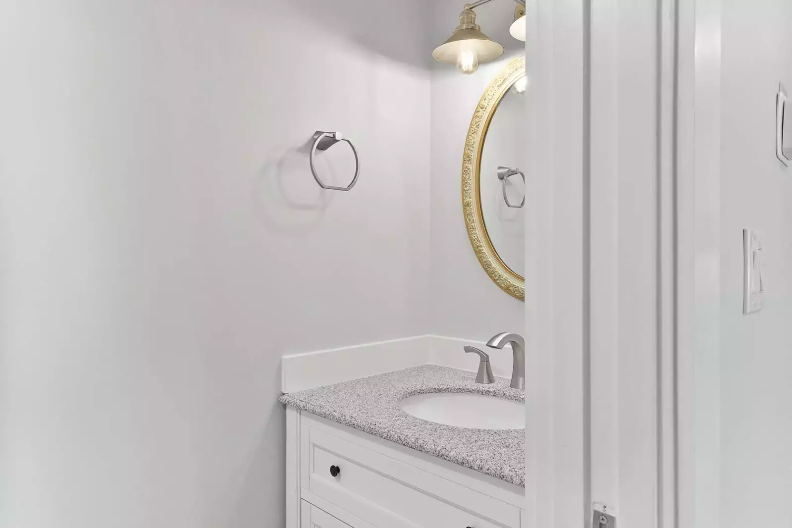 This half bathroom is located on the lower level near the living room.