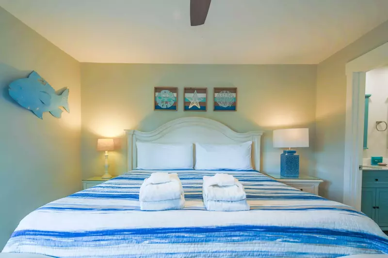 The master suite, which is located on the lower level of the villa, features a king bed.