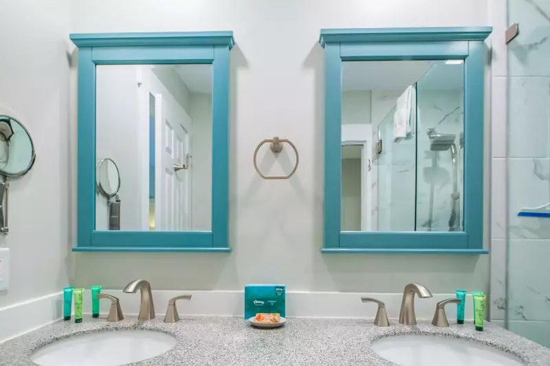 The spacious vanity has two sinks and two mirrors.