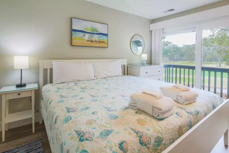 The king suite features a king bed with night stands and reading lamps.