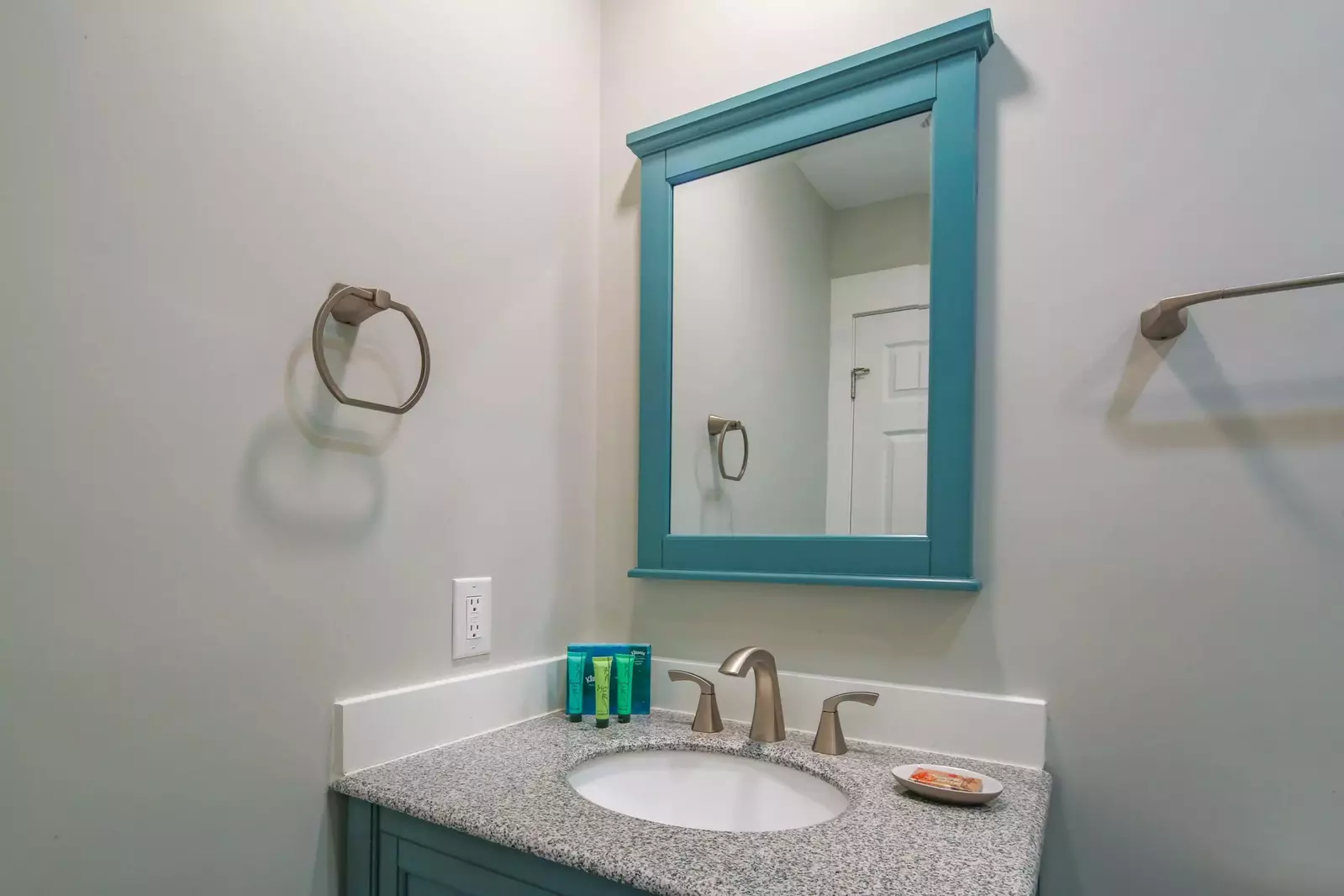 The en suite bathroom features a spacious vanity.
