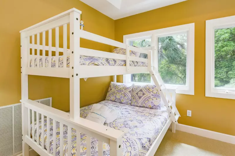 The bonus room features a bunk bed with a full bed on the bottom and a twin bunk on top.