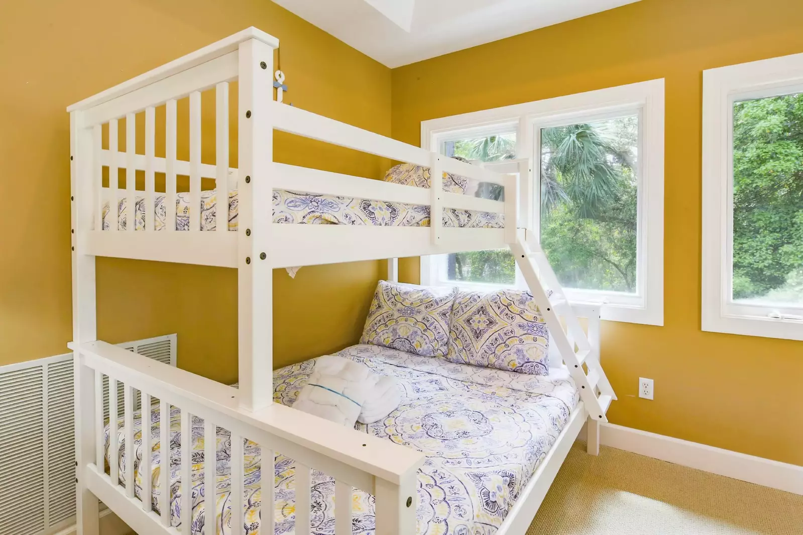The bonus room features a bunk bed with a full bed on the bottom and a twin bunk on top.