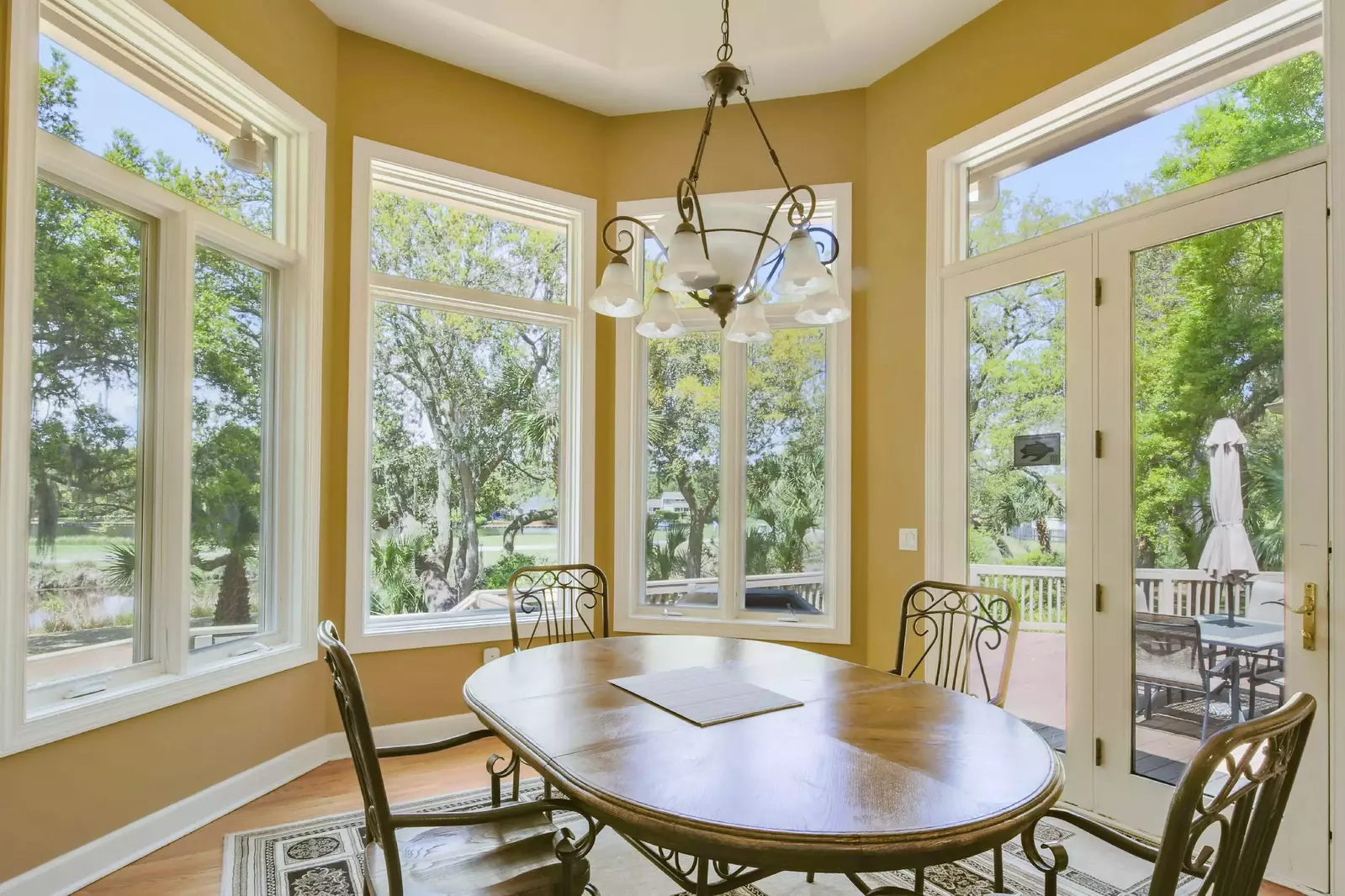 This dining table seats 4.  There is also an outdoor dining table and another indoor dining table.