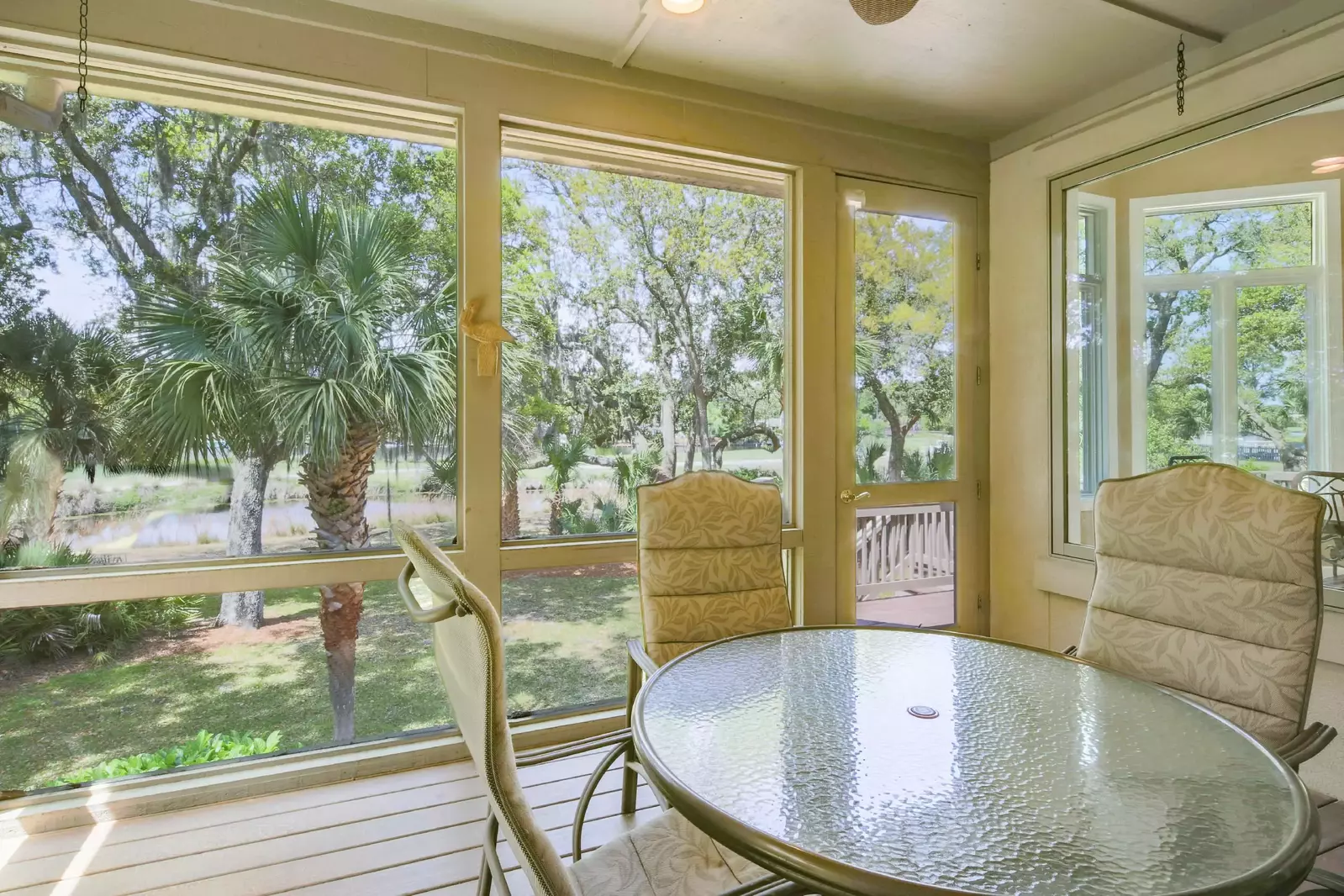 The screened porch features great views of the backyard and lagoon.