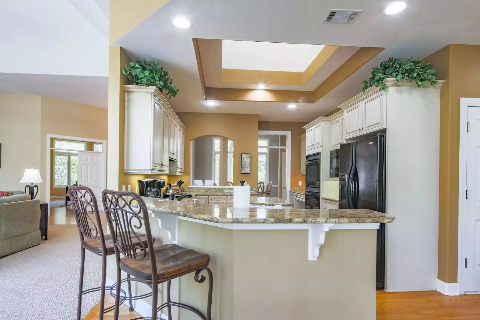 There are two stools alongside the kitchen counter.