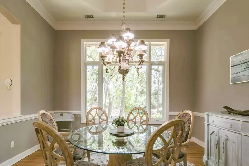 This dining table seats 6 and looks out the front side of the home.