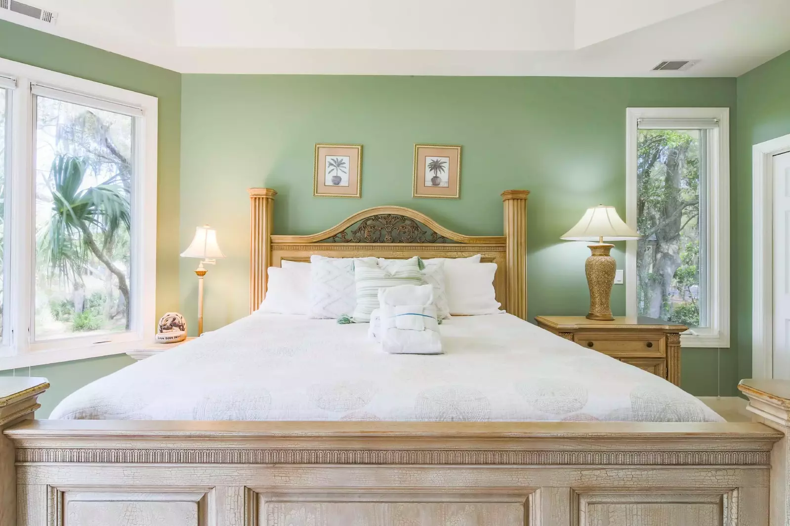 The master suite features a king bed, night stands and reading lamps.