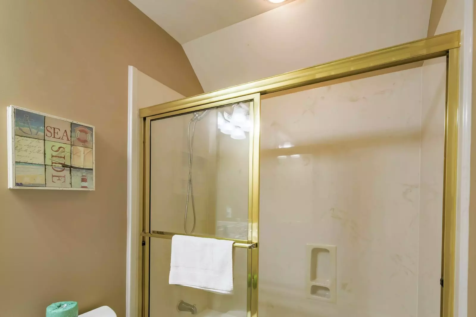 This bonus room bathroom also has a shower/tub combo.