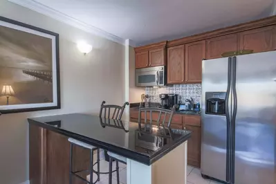 Ketch Studio features a kitchenette with refrigerator, cooktop, microwave, sink and coffee maker.