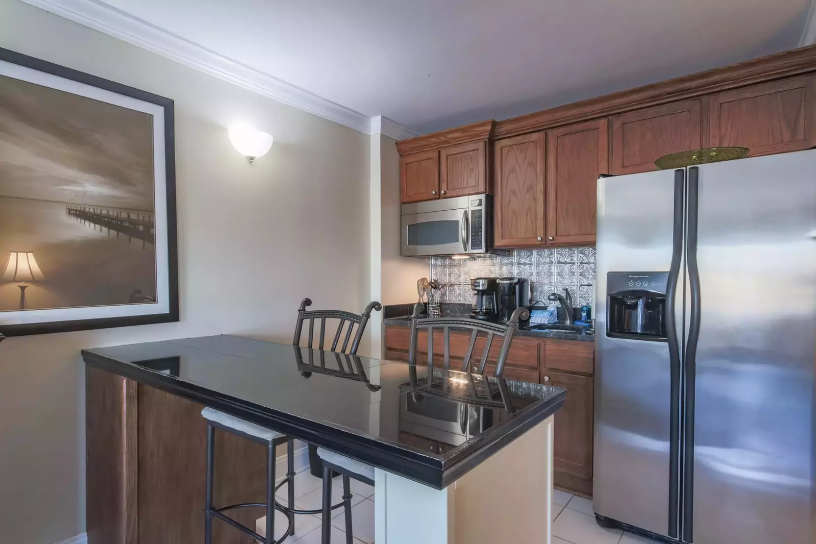 Ketch Studio features a kitchenette with refrigerator, cooktop, microwave, sink and coffee maker.