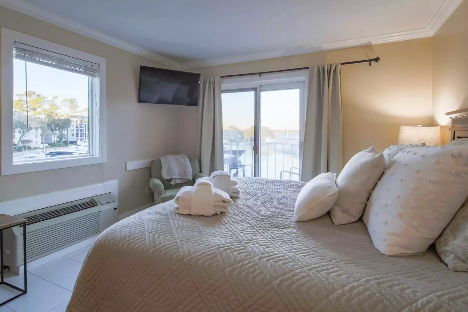 There is also a large window across from the bed.