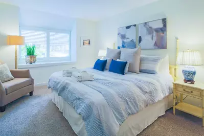 This comfortable master suite awaits you.