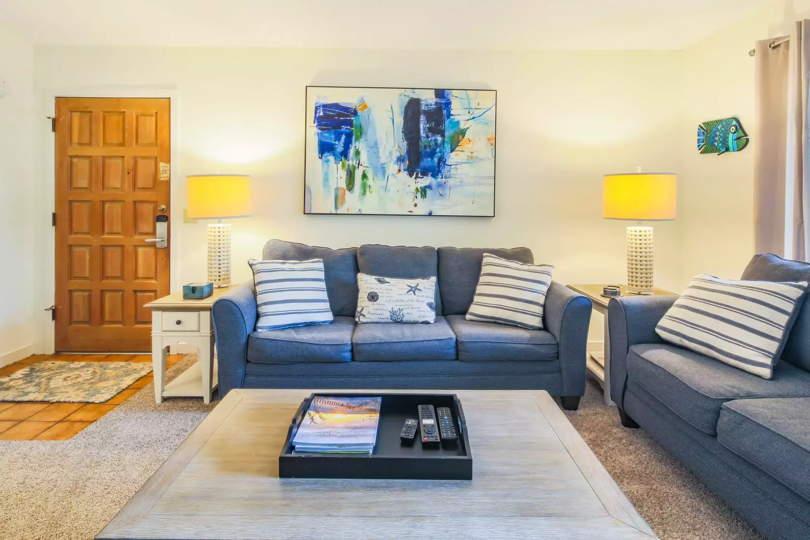 The living room features a spacious seating area.