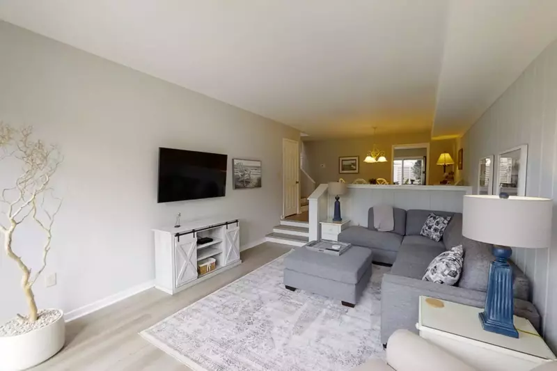 Living Room with comfortable seating and 58" smart Samsung TV