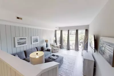 Family room opens to patio with golf course views.