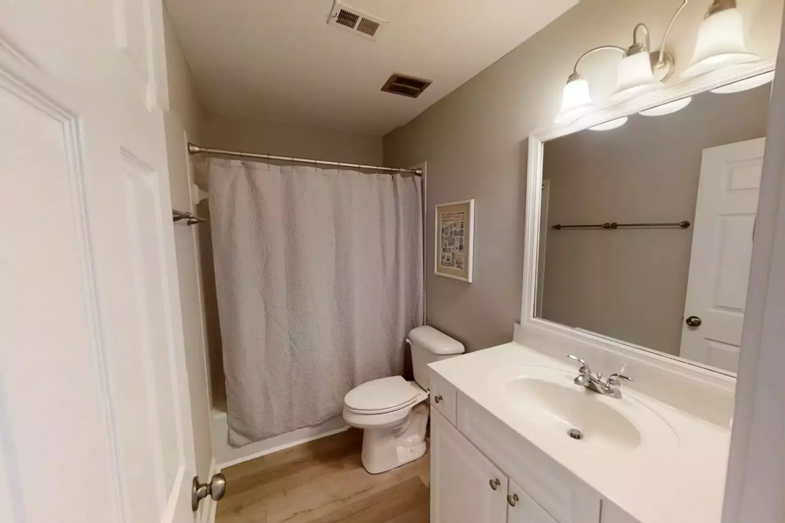 2nd Bathroom has single vanity and walk in shower.
