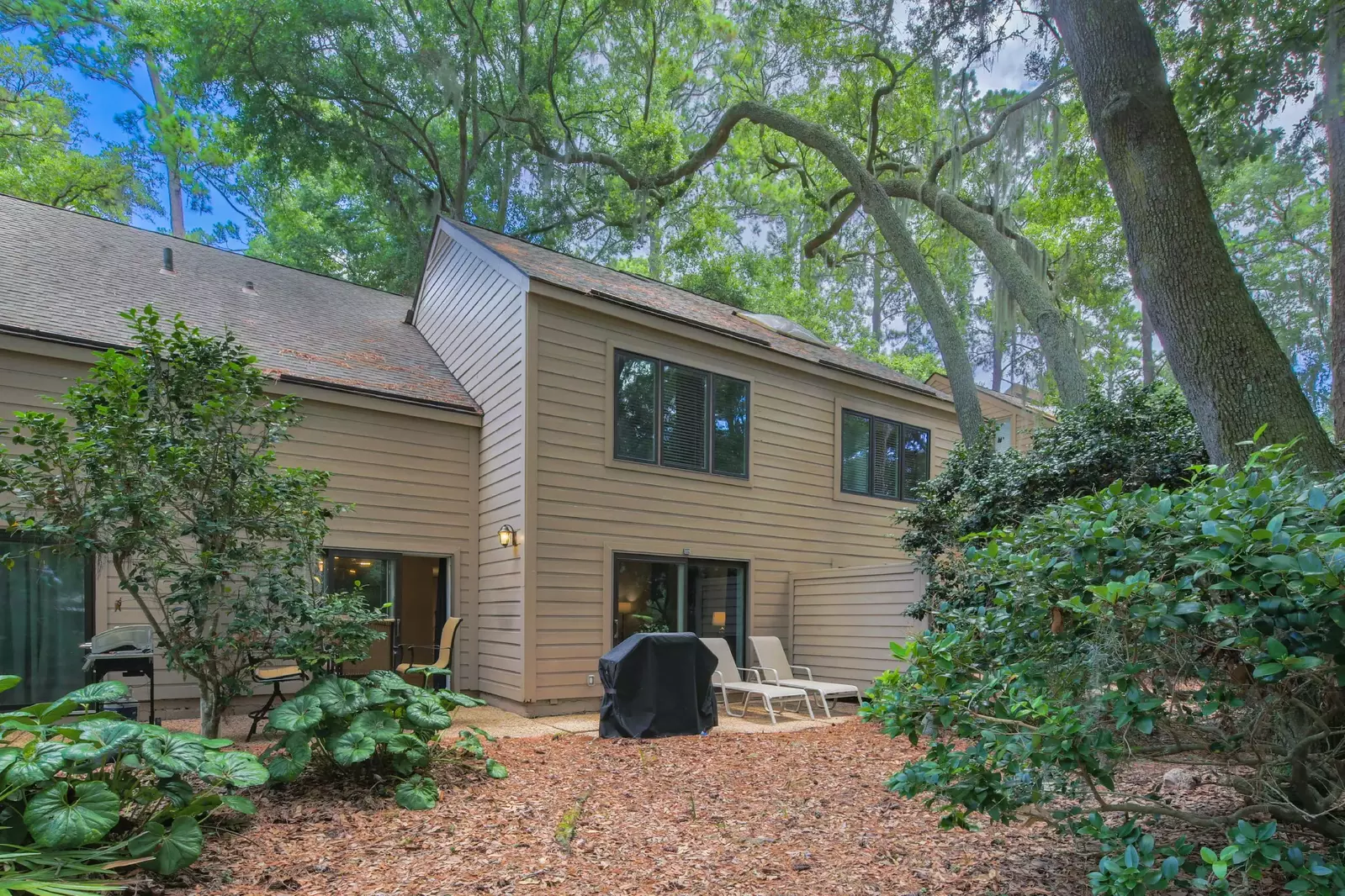 There are two sets of sliding glass doors that access the back patio -- one in living room and one in the dining room.