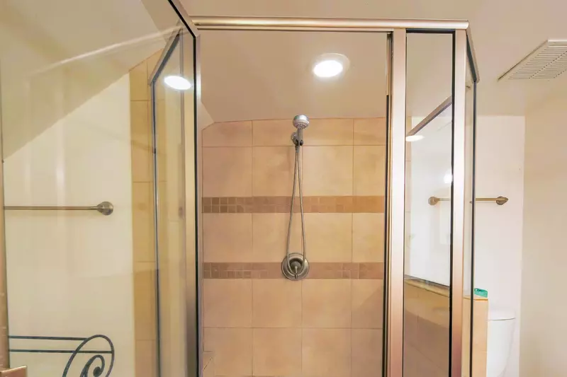 There is a tiled, walk-in shower in the en suite bathroom.