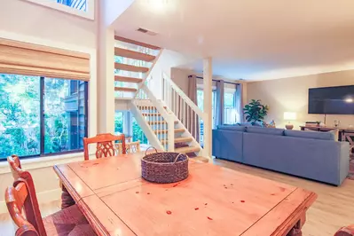 The open floor plan layout between the living room and dining area make it easy to interact with your guests.