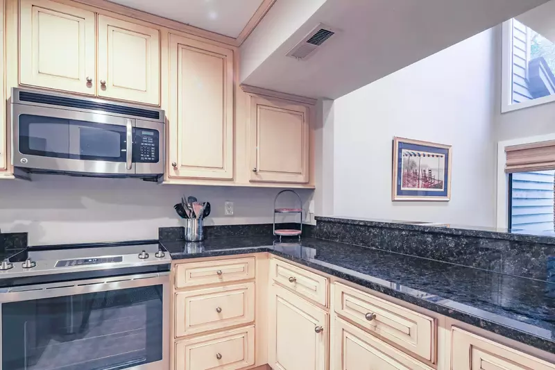The dining table is located just on the other side of this kitchen counter.
