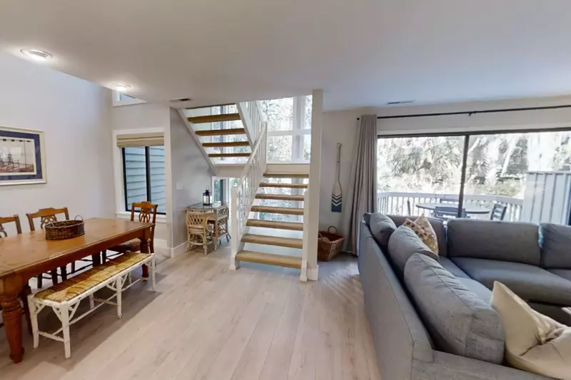 The stairwell in between the living room and dining area takes you to the second floor.