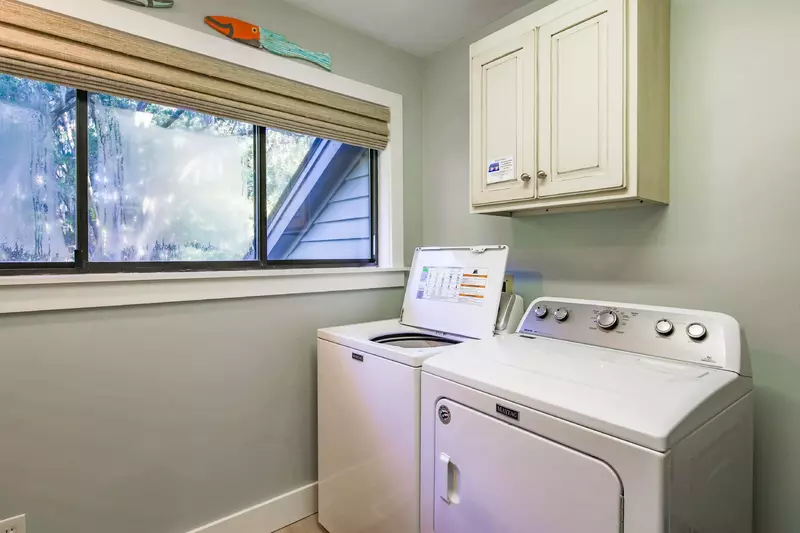 There is a full sized washing machine and dryer on the second floor.