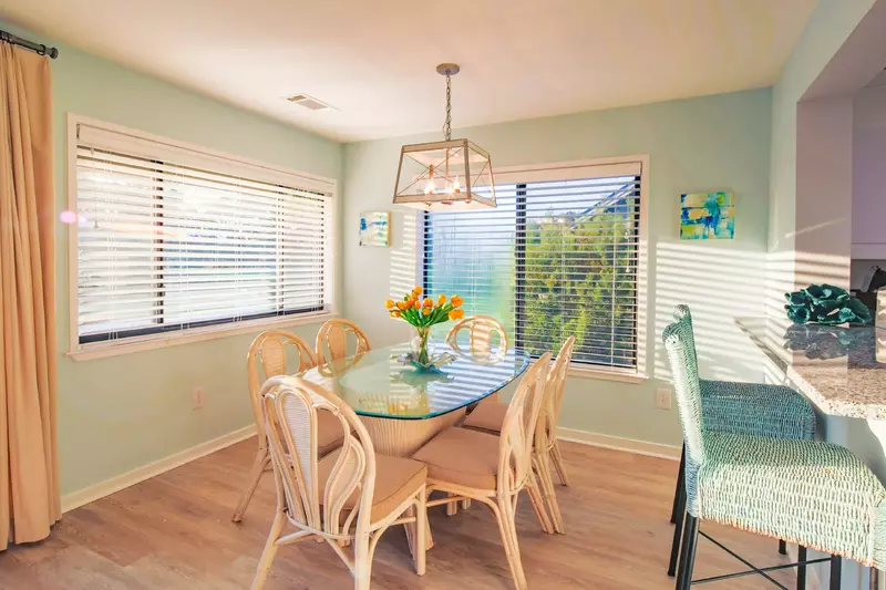 The dining table seats 8.  There are two additional stools at the kitchen counter.