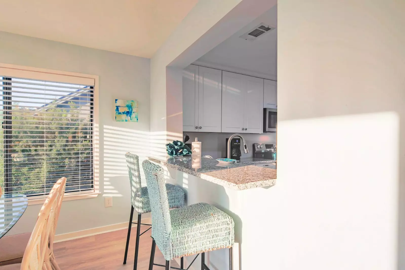 The kitchen counter separates the dining area from the kitchen.