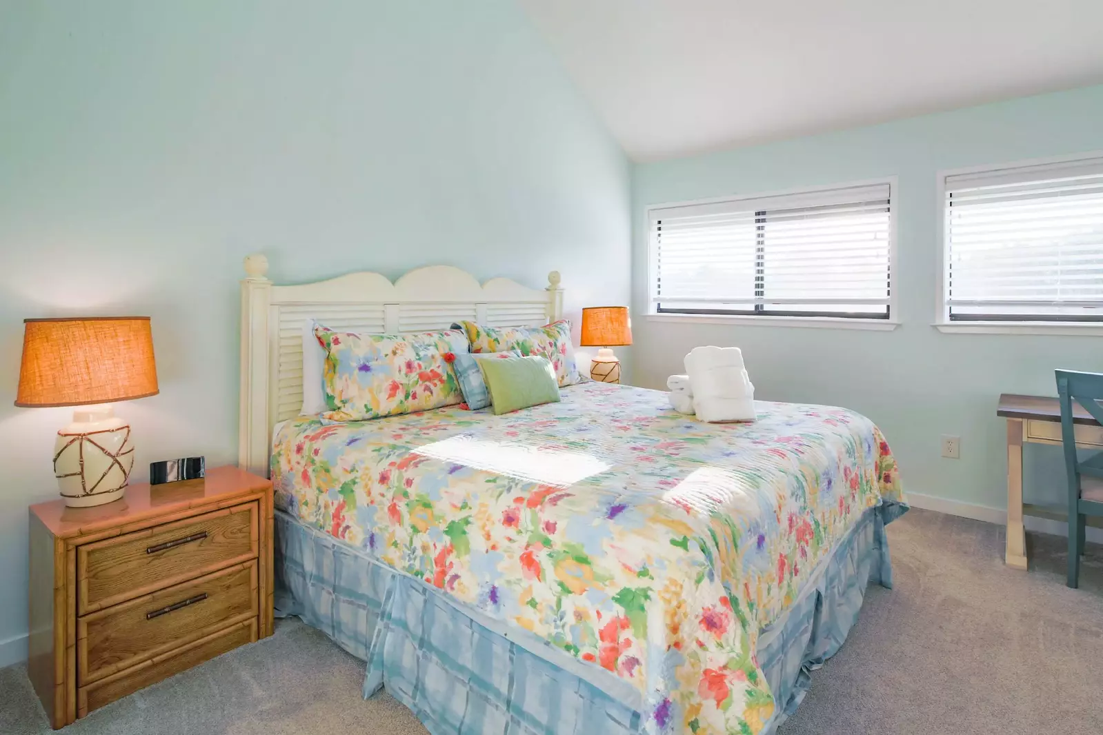 The master suite, which is located on the upper level, features a king bed.