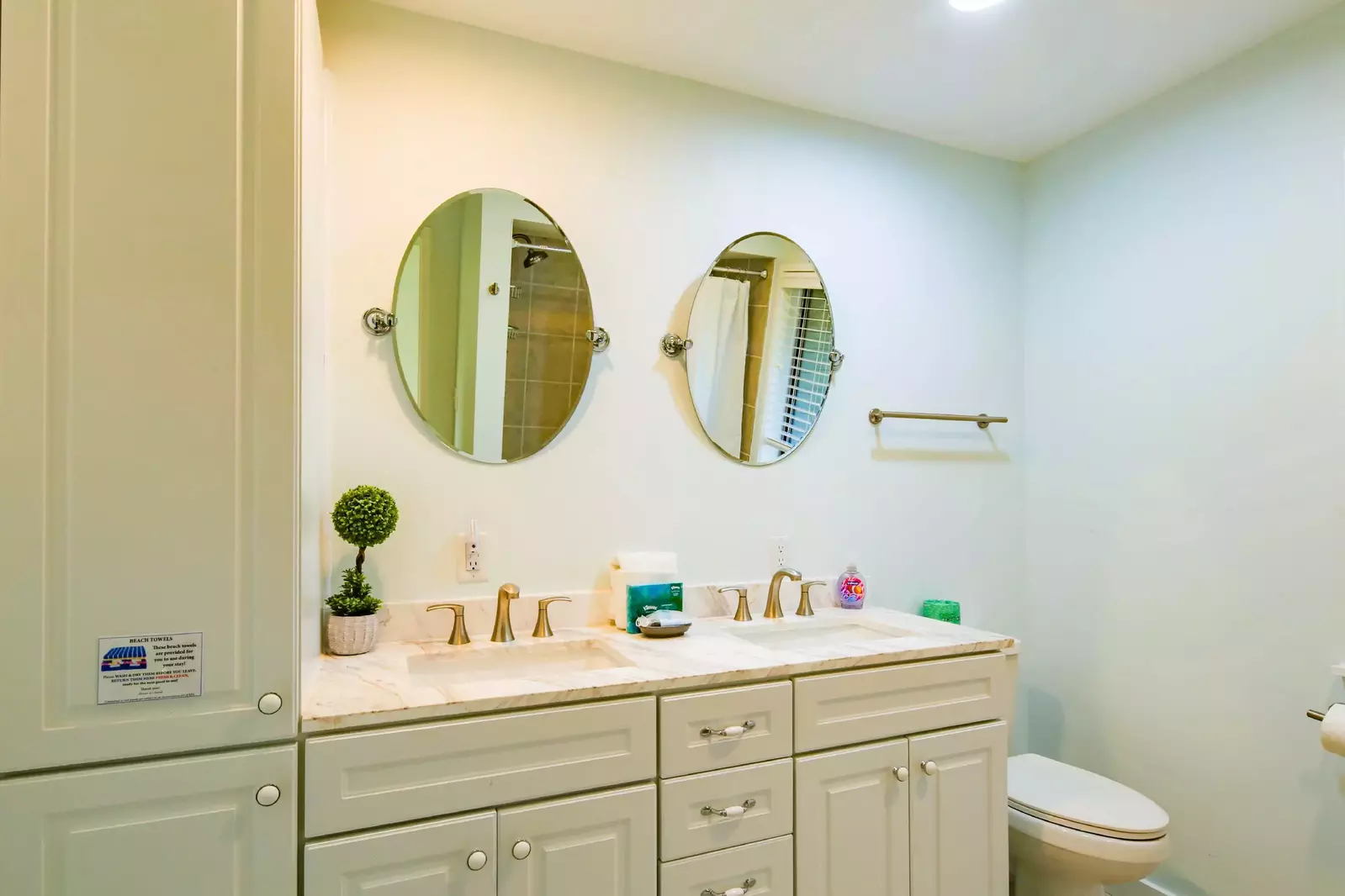 The en suite bathroom features a spacious, dual-sink vanity.