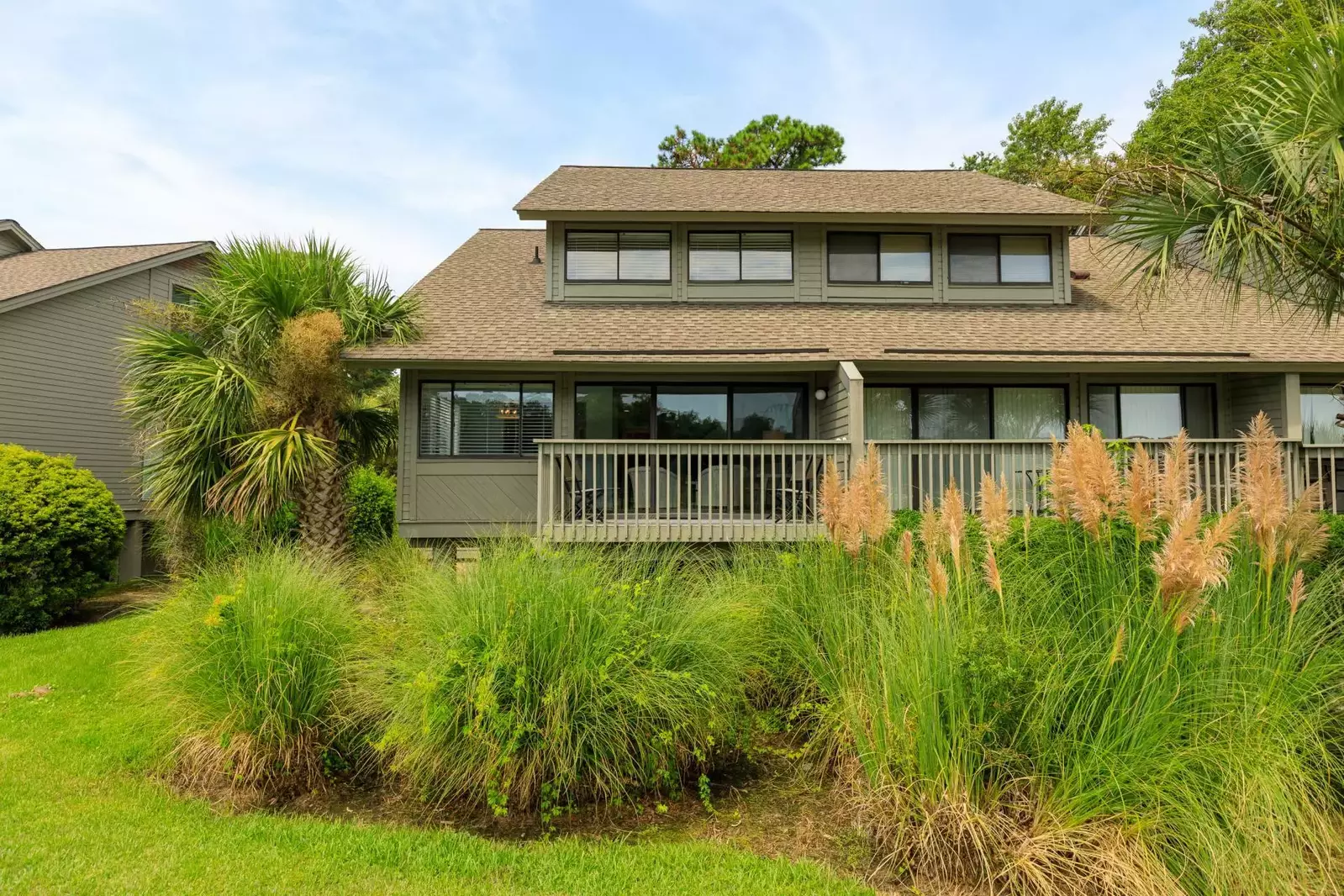 The Aurora is surrounded by palmetto trees, ornamental grasses and other Lowcountry plants.